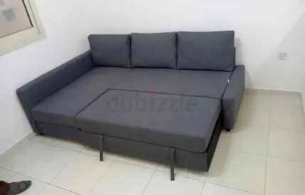 Grey L-shaped Sofa Bed with Storage — Good Condition