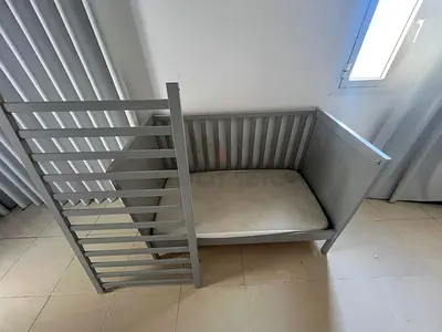Used IKEA grey wooden baby crib / toddler bed - solid frame, mattress included