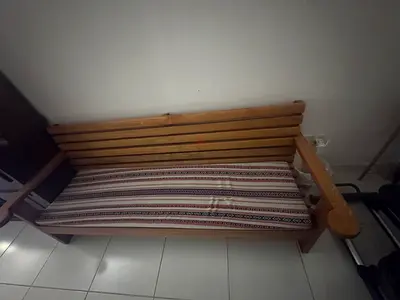 Solid wood bench with patterned cushion - good condition