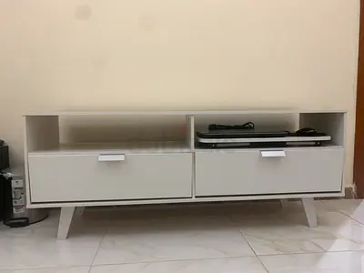 White modern low TV unit with drawers and open shelves