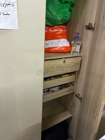 Used wooden wardrobe with drawers and hanging space — good condition 3 door