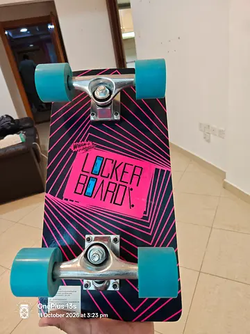 Locker Board cruiser skateboard with blue wheels - good condition