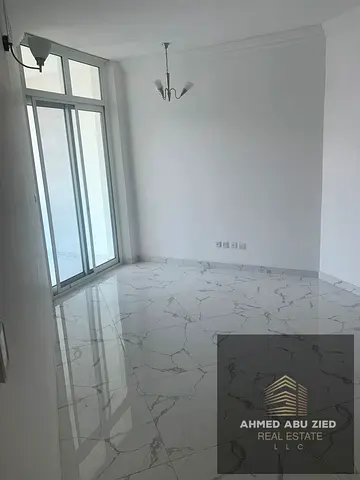 1BR + living room in Oasis Towers with balcony, 2 bathrooms and closed kitchen. Annual rent AED 37,000, payable in 4 installments.