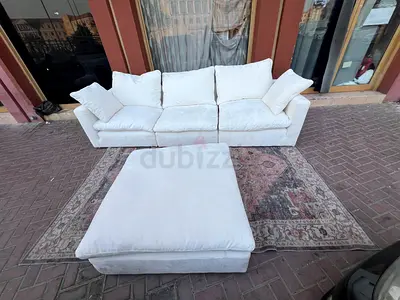 Modular feather filled sofa with footstool