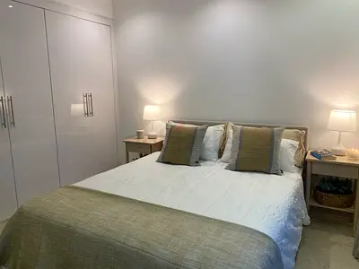 King bed with mattress and 2 bedside tables