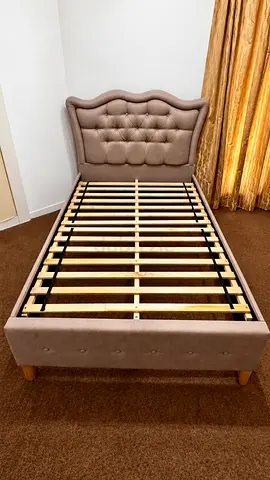 Single upholstered bed frame with tufted headboard