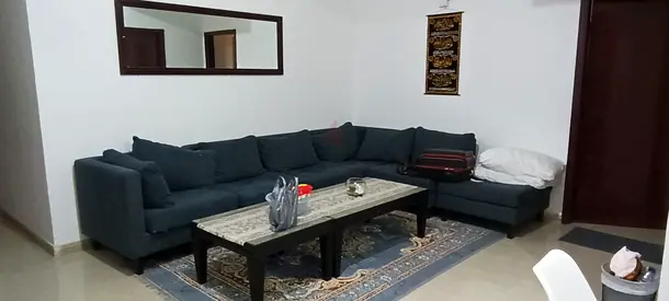 Large L-shaped fabric sofa with ottoman - dark teal, good condition