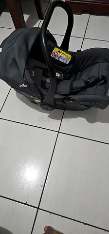 Joie infant car seat carrier - good condition- 7 months old - used 2 to 3 times only.