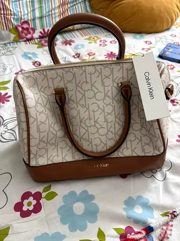 Calvin Klein beige monogram handbag with brown trim - excellent condition