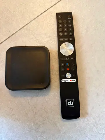 Small black media streaming box with remote - working condition