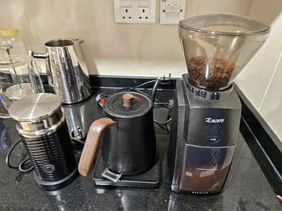 Coffee grinder with kettle and milk frother