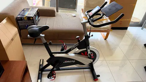 Joroto Indoor Spin Bike - Good Condition, Cushioned Seat & Tablet Holder