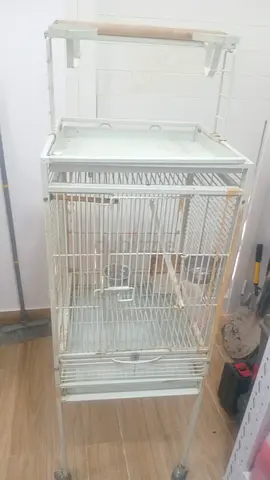 White metal bird cage on stand with play top - good condition, large size.