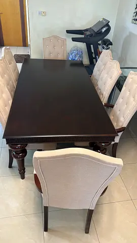 Dark solid wood dining table with 8 upholstered chairs one month old mint condition