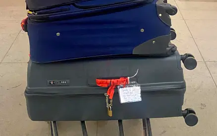 Used medium rolling suitcase with combination lock - good condition