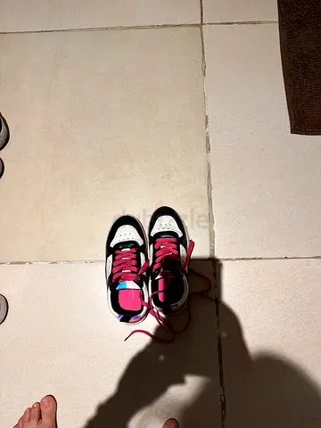 Kids pink and black sneakers - gently used, size likely children's