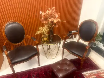 Pair of Vintage Leather Upholstered Armchairs with Ottoman and Side Table