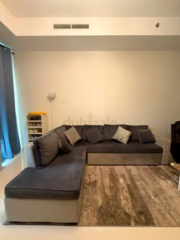 L-shaped Grey Fabric Corner Sofa with Cushions - Good Condition