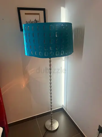 Silver twisted-rod floor lamp with blue patterned drum shade