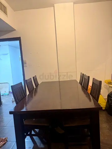 Solid dark wood dining table with 6 chairs - good condition