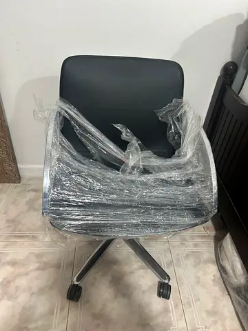 Black ergonomic office chair on wheels - good condition