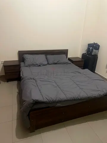 Queen wooden bed frame with two matching bedside tables - dark brown