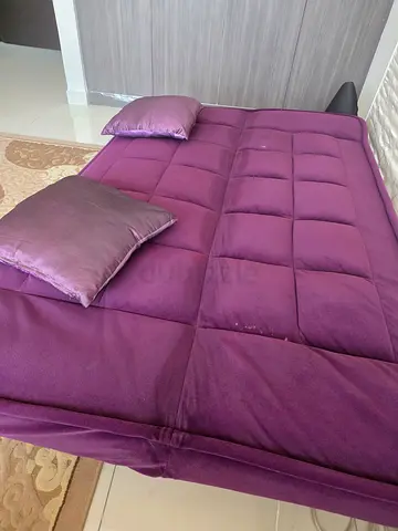 Purple futon sofa bed in good condition