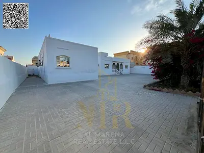 A luxurious 5-bedroom villa for sale in Al Rawdah, featuring sophisticated design and premium finis