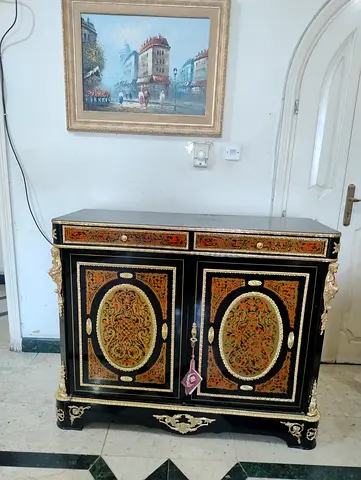 Antique-style black and gold cabinet with intricate inlay — good condition