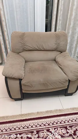 Single beige upholstered armchair - comfortable lounge chair
