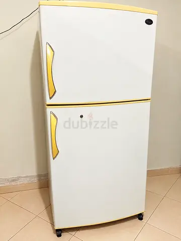 Used Double-Door Refrigerator - Compact Top Freezer, Good Working Condition for sale.
