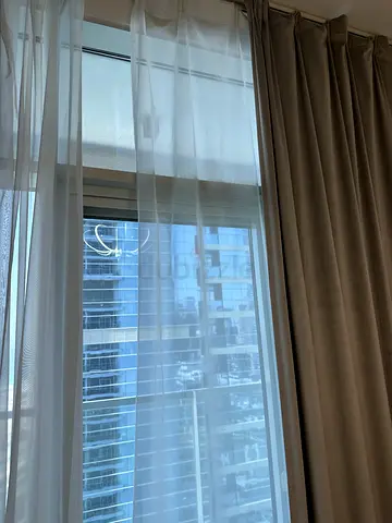 Two-layer beige blackout curtains with white sheer panels - good condition