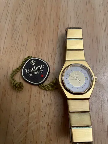 Vintage Zodiac gold-tone women's quartz watch with original tag