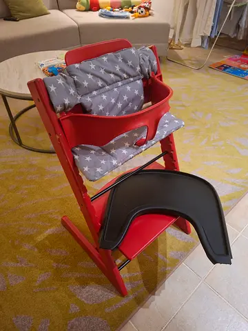 Stokke Wooden adjustable high chair with star-patterned cushion