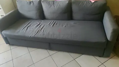 Three-seater dark grey fabric Bed cum sofa — good condition