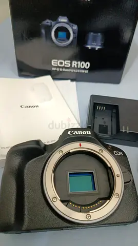 Canon EOS R100 mirrorless body plus lens with original box and charger and few extra Accessories