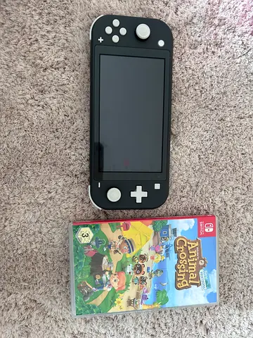 Nintendo Switch Lite (Gray) with Animal Crossing: New Horizons and arcade toy