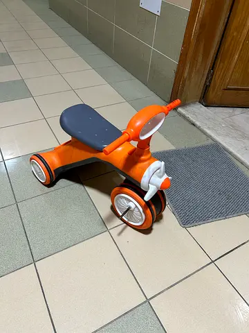 Orange toddler ride-on scooter - sturdy 3-wheel balance toy