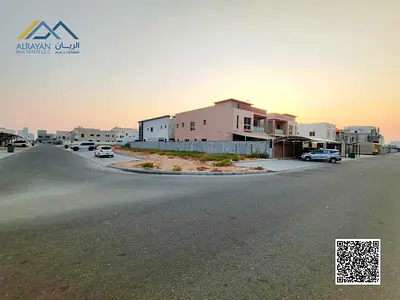 أرض زاوية سكني استثماري فريدة في العالية عجمان تصريح طابقين تملك حر 100% لكافة الجنسيات على شوارع قار بموقع استراتيجي