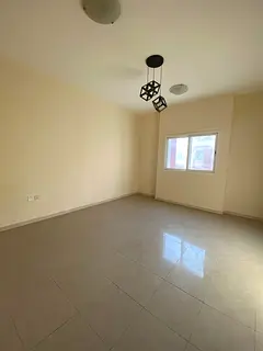 Al Hamidiya 1 | Spacious 2-Bedroom Apartment with Indoor Parking, Central AC, and a Convenient Locat
