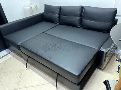 Black faux leathe  sofa bed with storage - good condition