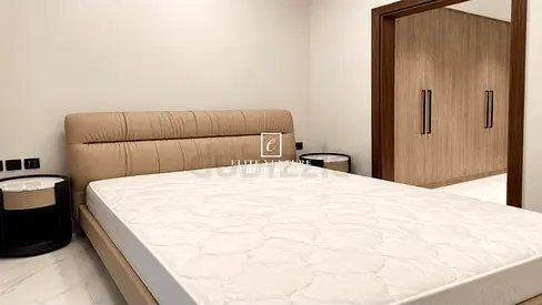 King size upholstered bed with brand new spring mattress and bedside tables