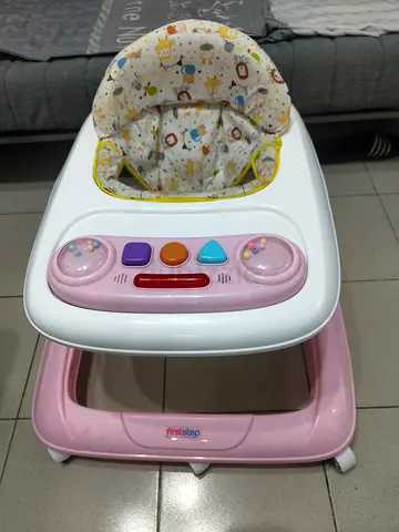 Gently used baby walker with removable toy tray and padded seat