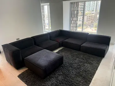 Ebraza Large modular black velvet L-shaped sofa with ottoman (excellent condition - no damage)