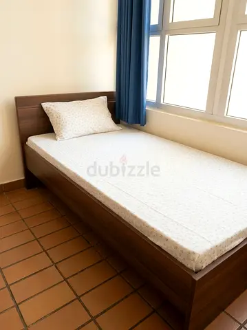 Single wooden bed frame with mattress