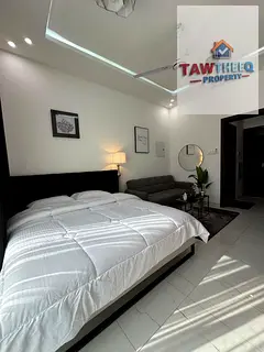 Monthly rental studio in Al Muweihat 2, Ajman, first tenant, with a balcony and a separate kitchen