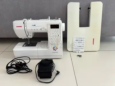 Janome M100QC computerized sewing machine with accessories (good working condition)