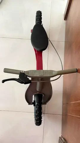 Red balance bike for kids — lightweight, used, good condition