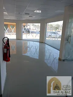 Commercial shops for rent in Al Manakh, Sharjah, directly facing Al Manakh Park. They feature a prim