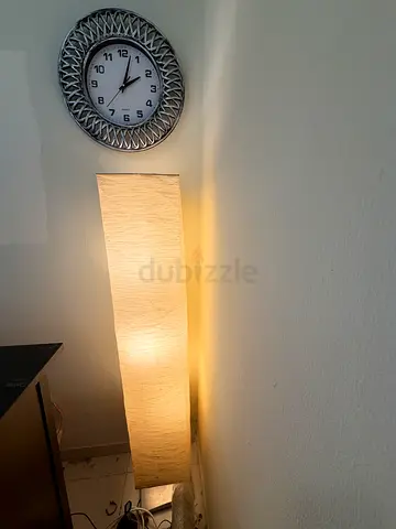Tall rectangular fabric floor lamp from IKEA — warm ambient light